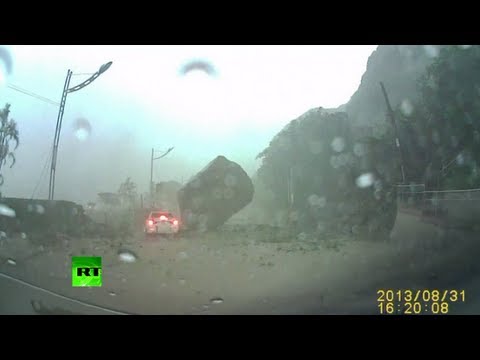 Thumbnail for the embedded element "Dash cam video: Driver engulfed in Taiwan landslide, narrowly escapes huge boulder"