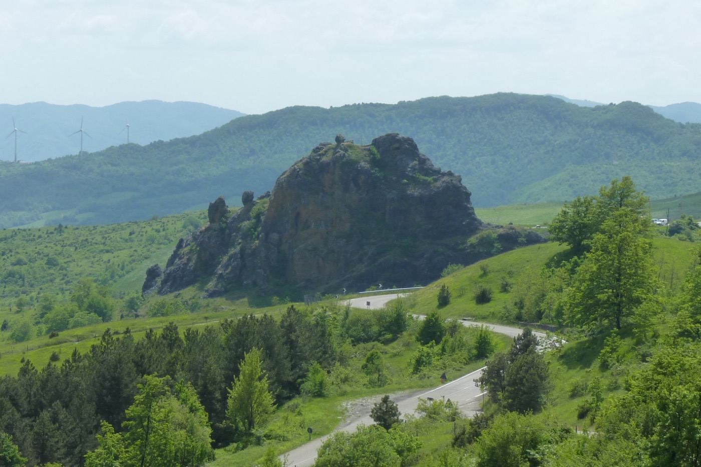 An outcropping of rocks amidst a lush landscape