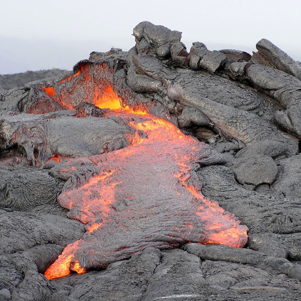 Lava flowing over a field of basalt.