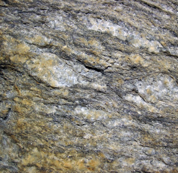 a rock with elements of gray, white, and light green