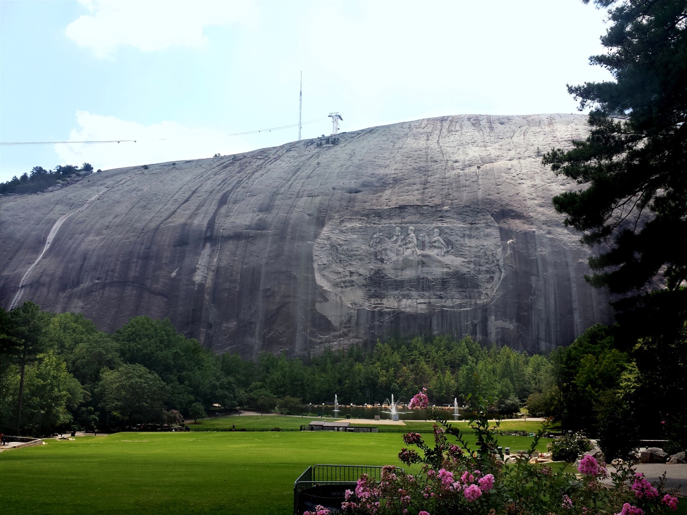 A mountain that resembles a large smooth stone, with a confederate memorial, soldiers and horses, carved into it
