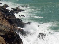 Waves crashing on sea cliff at Point Reyes Headlands