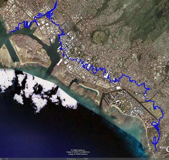 satellite image showing flooding on the coast of a Hawaiian island. see caption