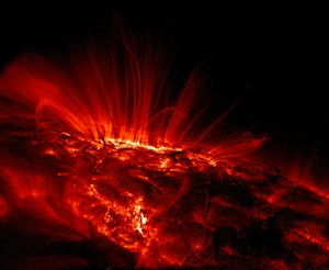 Glowing arcs of gas surrounding sunspots