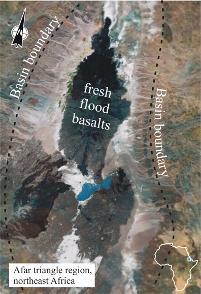 Annotated satellite photo of the Afar Triangle region of northeast Africa. Alluvial fans descend from the basin boundary into the low-lying central area. There are also lakes down there, and vast white salt flats. There are also five major blotches of jet-black flood basalts.