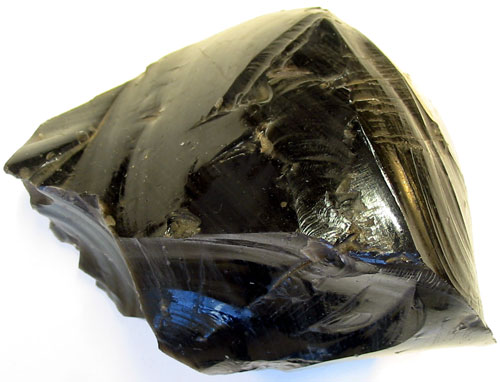 A specimen of obsidian, a glassy black rock showing conchoidal fracture