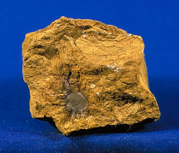 Orange-rust colored mineral that looks like a lump of dirt