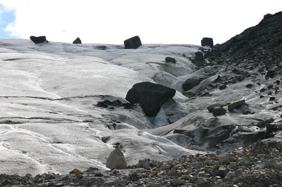 Large boulders and smaller sand are seen together.