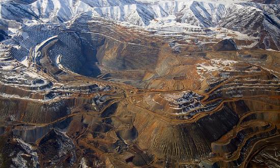 The image is a large hole in a mountainside.