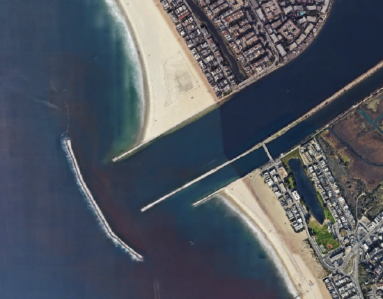 The two jetties led to a coastal waterway with more sand on the left jetty.