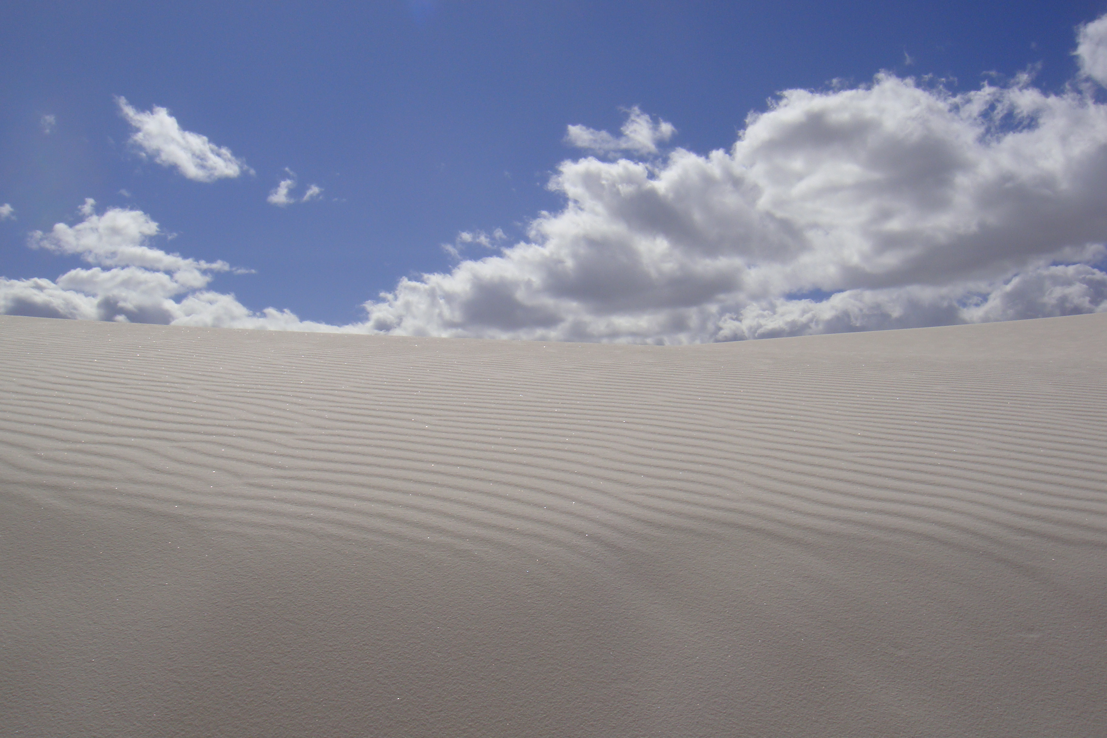 Rippled white sand in the desert.