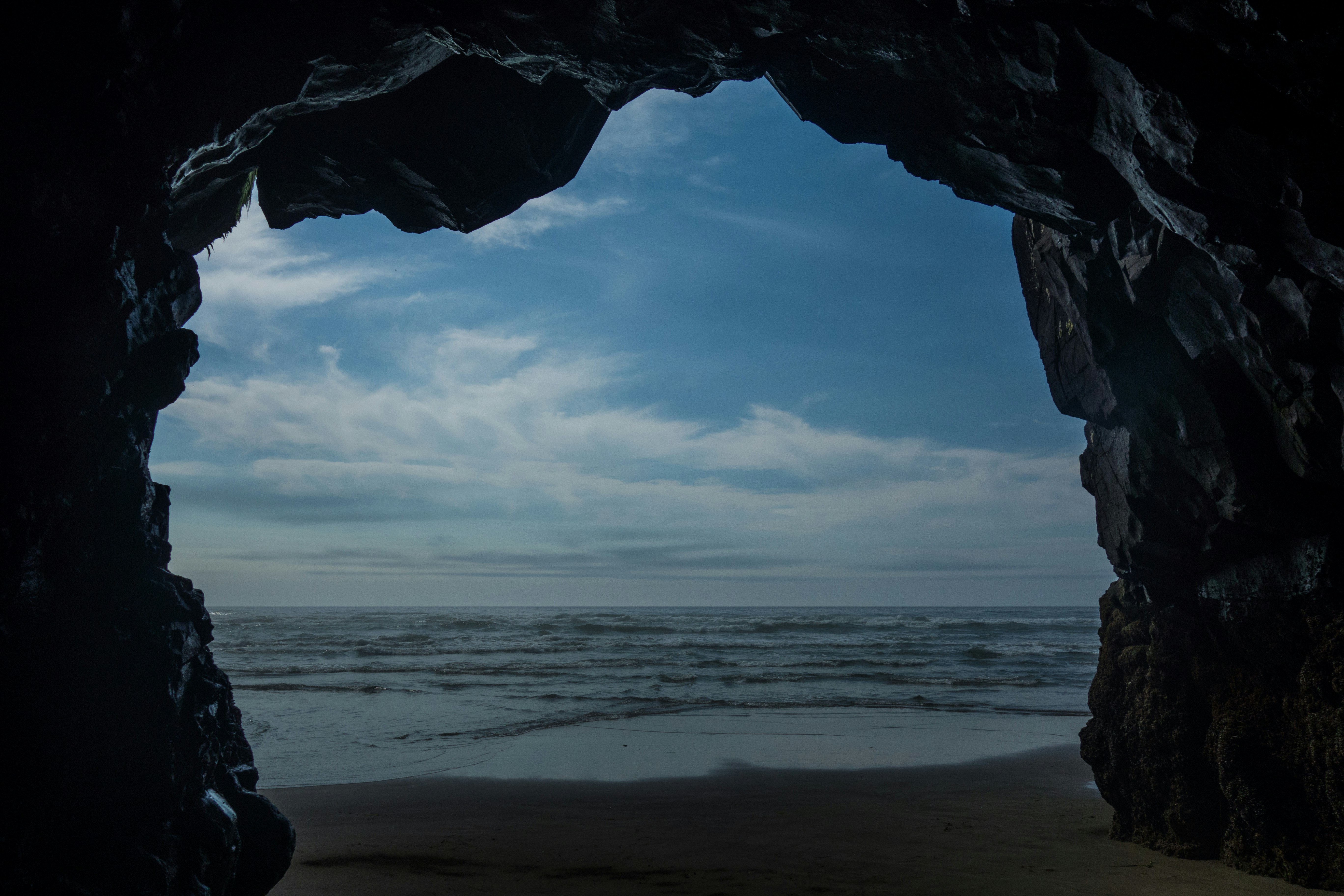 ocean view through a hole in the rock