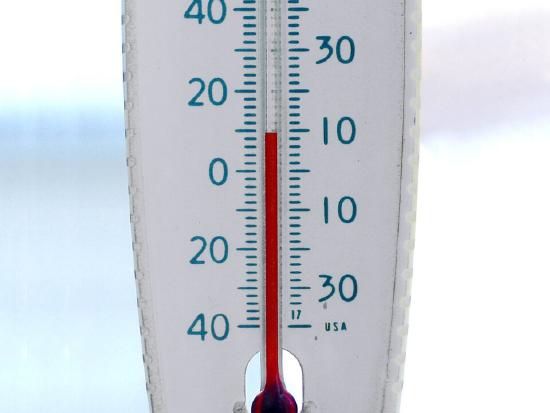 A thermometer measures ambient temperature.