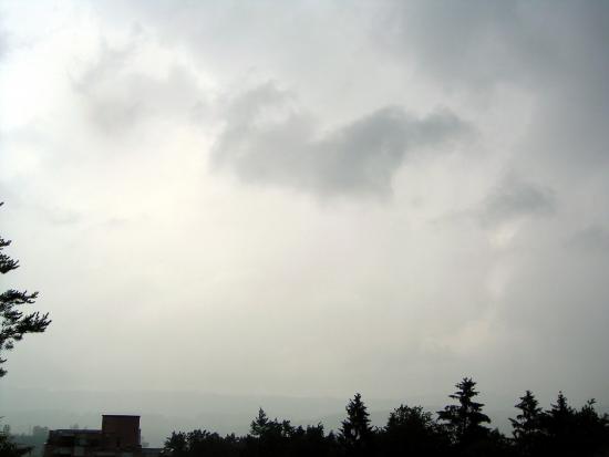 Darker cloud layer covering the sky and raining.
