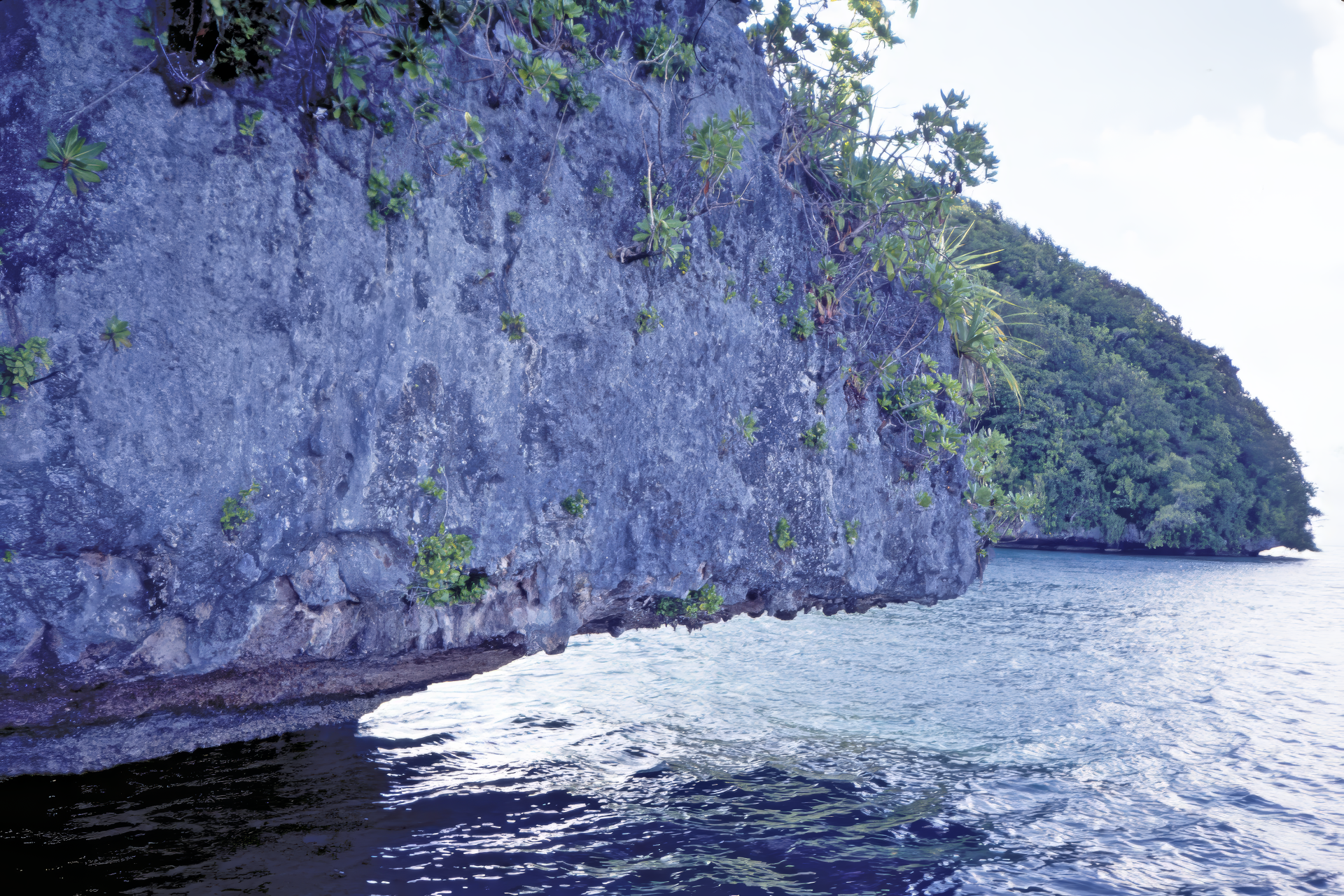 Rocky overhang above water