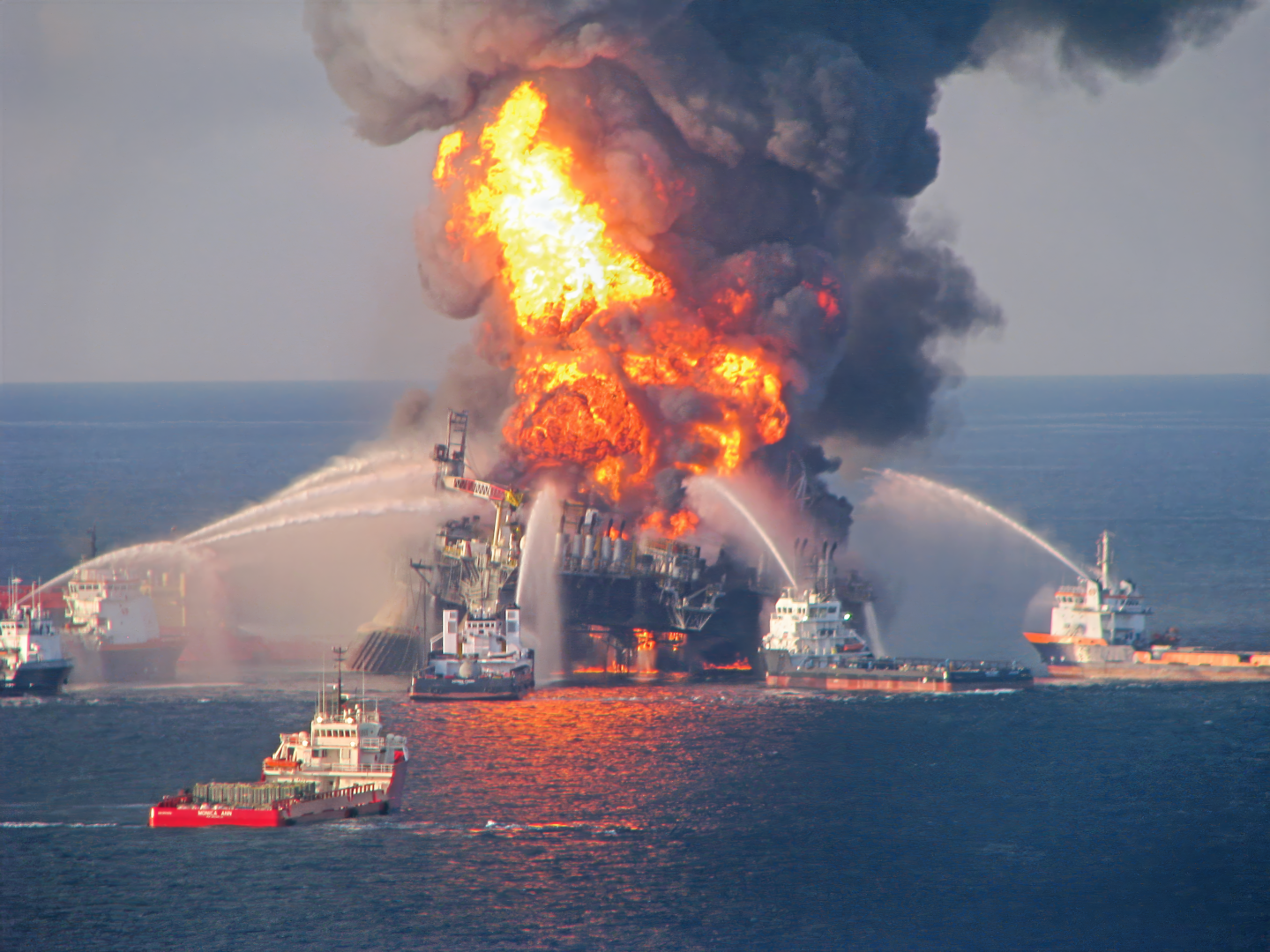 Many boats trying to put out a blazing rig