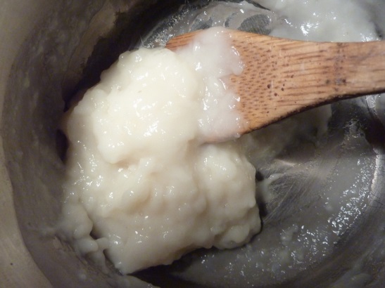 Thick, white goop in a pot.