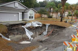 Sinkhole that appeared in Florida in the front yard of a home.