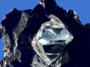 The diamond is clear and pyramidal