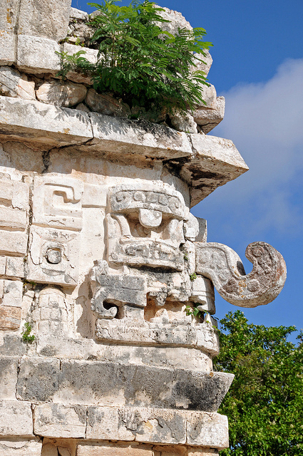 Mayan stone figure with a long elephant-like nose representing a water deity.