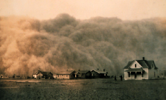 The black and white photo shows a giant wall of dust.