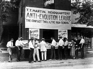 There are several people around a sign