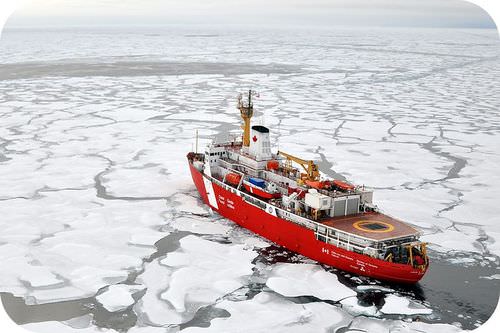 A boat cutting through floating ice