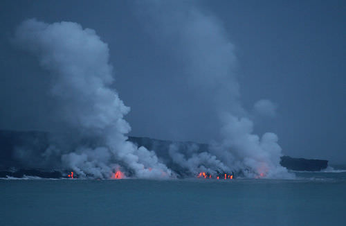 Lava flowing into the Pacific Ocean in Hawaii, creating new land